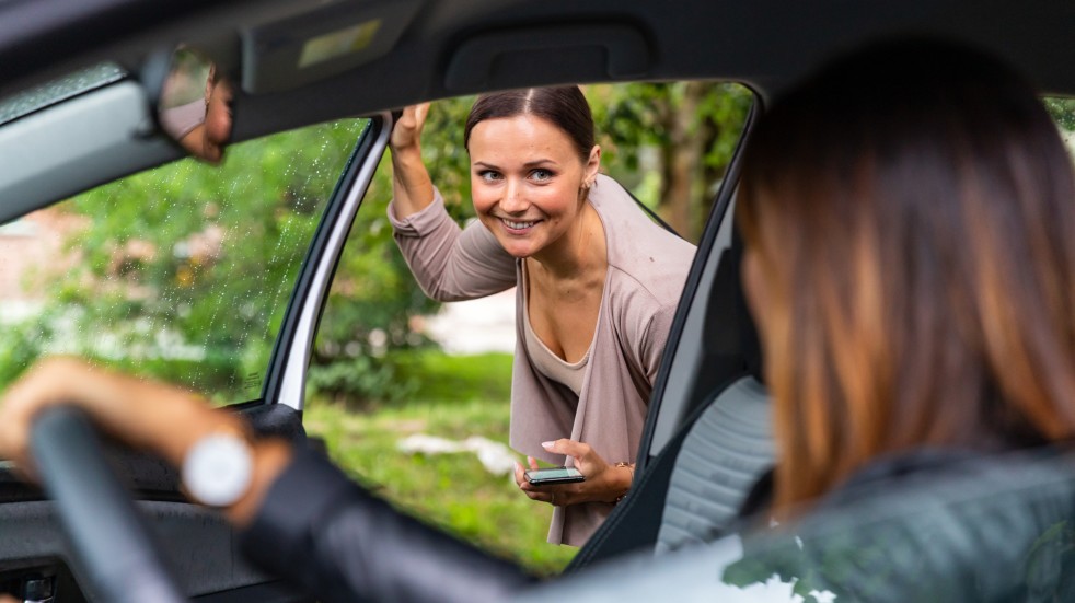 women sharing car